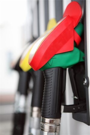 Several gasoline pump nozzles at petrol station Stock Photo - Budget Royalty-Free & Subscription, Code: 400-04666678