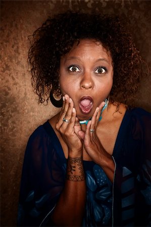 Surprised and shocked African American woman caught by photographer Stock Photo - Budget Royalty-Free & Subscription, Code: 400-04666687