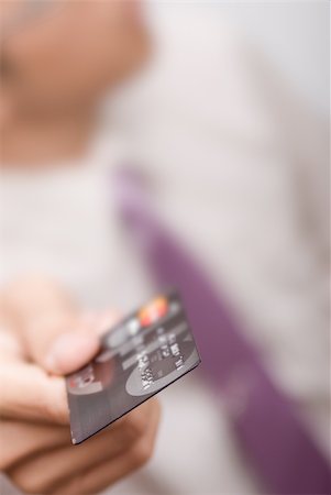 simsearch:400-05708287,k - Business man holding credit card, shallow DOF. Stock Photo - Budget Royalty-Free & Subscription, Code: 400-04669756