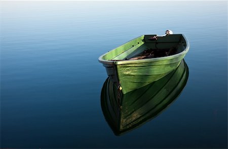 simsearch:400-05308802,k - Single Row boat on Lake with Reflection in the Water Stock Photo - Budget Royalty-Free & Subscription, Code: 400-04660088