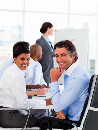 simsearch:400-04113367,k - A diverse business group at a meeting smiling at the camera Stock Photo - Budget Royalty-Free & Subscription, Code: 400-04660439