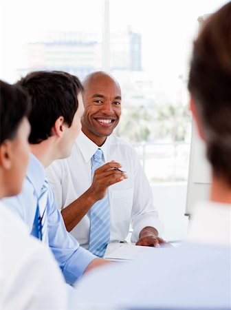 simsearch:400-04113367,k - Portrait of smiling business team during a meeting in the office Stock Photo - Budget Royalty-Free & Subscription, Code: 400-04660441