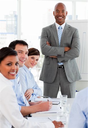simsearch:400-04113367,k - International business team smiling at the camera in a meeting Stock Photo - Budget Royalty-Free & Subscription, Code: 400-04660443