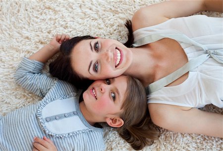 simsearch:400-04654755,k - Happy little girl and her mother lying on the floor with heads together Foto de stock - Super Valor sin royalties y Suscripción, Código: 400-04660466