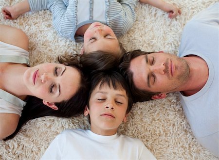 simsearch:400-04654755,k - Young Family sleeping on the floor with heads together Foto de stock - Super Valor sin royalties y Suscripción, Código: 400-04660463
