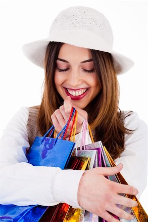 simsearch:400-04158321,k - Closeup of women holding her shopping bags very happily on a white background Stock Photo - Budget Royalty-Free & Subscription, Code: 400-04661205