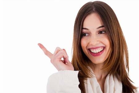 simsearch:400-04158321,k - attractive female model smiling and pointing her finger at copy space on white background Stock Photo - Budget Royalty-Free & Subscription, Code: 400-04661220