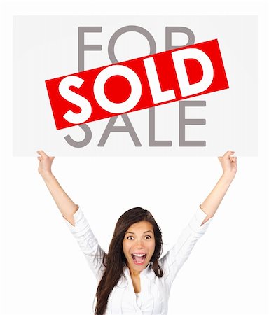 simsearch:700-03508131,k - Young successful mixed race asian / caucasian real estate agent or owner holding a for sale sign for a sold house. Isolated on white background. Stock Photo - Budget Royalty-Free & Subscription, Code: 400-04661708