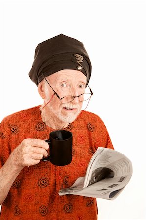 simsearch:400-05372618,k - Skeptical New Age Man with Coffe and Newspaper Stock Photo - Budget Royalty-Free & Subscription, Code: 400-04663440