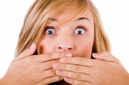 simsearch:400-04158321,k - Closeup of young women covering her mouth with both hands on a white isolated background Stock Photo - Budget Royalty-Free & Subscription, Code: 400-04674651