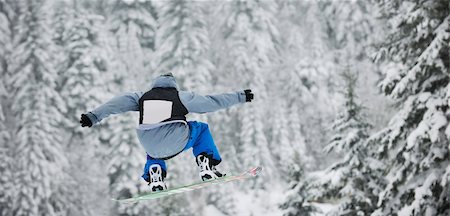 simsearch:400-03985663,k - young boys jumping in air ind showing trick with snowboard at winter season Stock Photo - Budget Royalty-Free & Subscription, Code: 400-04676178