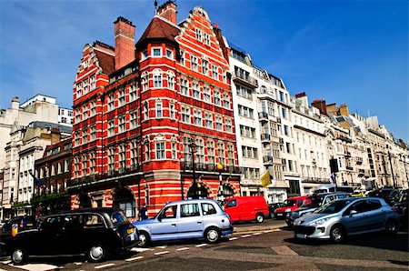London taxi on busy street corner in England Photographie de stock - Aubaine LD & Abonnement, Code: 400-04678037