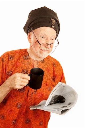 simsearch:400-05372618,k - Skeptical New Age Man with Newspaper and Coffee Stock Photo - Budget Royalty-Free & Subscription, Code: 400-04670411