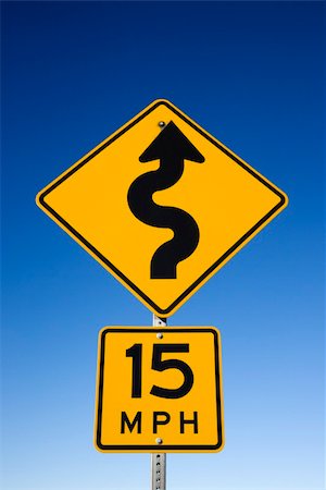 Curvy road warning sign with second sign saying 15 mph. Vertical shot. Stock Photo - Budget Royalty-Free & Subscription, Code: 400-04671890