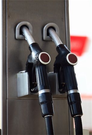 simsearch:6105-05395912,k - Fuelling gas nozzles on gasoline filling station Stock Photo - Budget Royalty-Free & Subscription, Code: 400-04672653