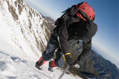 simsearch:400-05118687,k - Mountain climber use ice axe to walk on snow ice slop in winter. Stock Photo - Budget Royalty-Free & Subscription, Code: 400-04672771