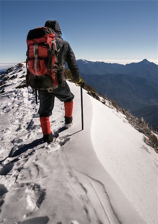 simsearch:400-05118687,k - Single man of climber walk alone on top of snow ice winter mountain. Stock Photo - Budget Royalty-Free & Subscription, Code: 400-04672772