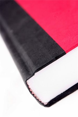 simsearch:700-00150473,k - Closeup of a red and black book isolated on a white background Stock Photo - Budget Royalty-Free & Subscription, Code: 400-04673415