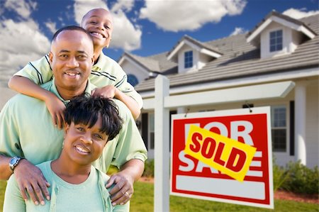 simsearch:693-03308239,k - Happy and Attractive African American Family with Sold For Sale Real Estate Sign and House. Stock Photo - Budget Royalty-Free & Subscription, Code: 400-04684304