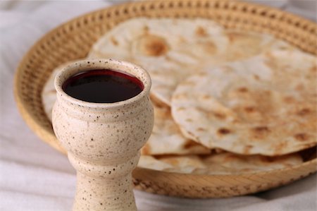 Chalice with red wine and pita bread in a basket Stock Photo - Budget Royalty-Free & Subscription, Code: 400-04684938