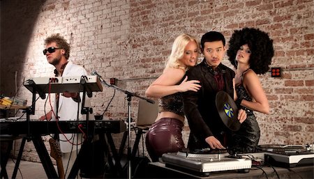 dancing piano - Mac Daddy DJ with Ladies at a 1970s Disco Music Party Photographie de stock - Aubaine LD & Abonnement, Code: 400-04686051