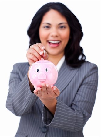 simsearch:400-04184165,k - Self-assured young businesswoman saving money in a piggybank against a white background Stock Photo - Budget Royalty-Free & Subscription, Code: 400-04687306