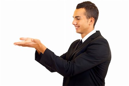 Young man showing something on his hand over white Stock Photo - Budget Royalty-Free & Subscription, Code: 400-04688312