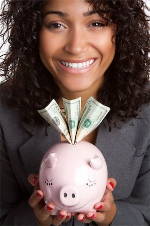 simsearch:400-05715207,k - Smiling woman holding piggy bank Stock Photo - Budget Royalty-Free & Subscription, Code: 400-04689670