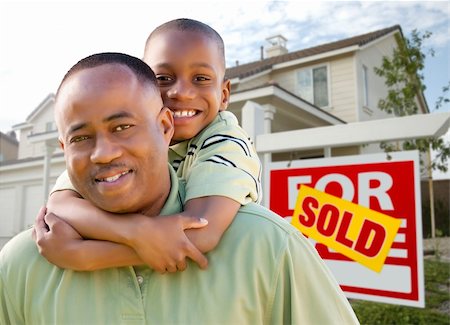 simsearch:693-03308239,k - Happy African American Father and Son in Front of New Home and Real Estate Sign. Stock Photo - Budget Royalty-Free & Subscription, Code: 400-04680155