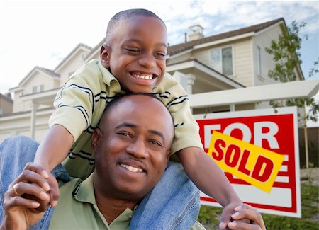 simsearch:693-03308239,k - Happy African American Father and Son in Front of New Home and Real Estate Sign. Stock Photo - Budget Royalty-Free & Subscription, Code: 400-04680157