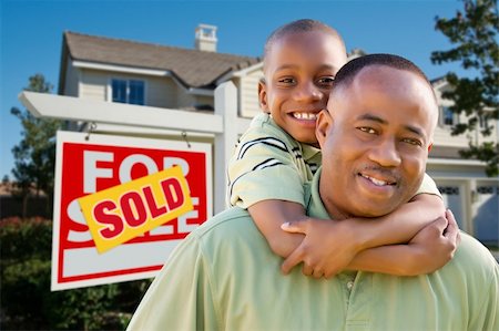 simsearch:693-03308239,k - Happy African American Father and Son in Front of New Home and Real Estate Sign. Stock Photo - Budget Royalty-Free & Subscription, Code: 400-04680159