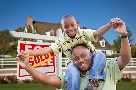 Happy African American Father and Son in Front of New Home and Sold Real Estate Sign. Foto de stock - Super Valor sin royalties y Suscripción, Código: 400-04680474