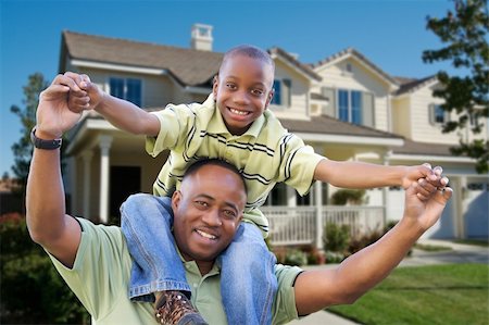 Playful African American Father and Son In Front Yard of Home. Foto de stock - Super Valor sin royalties y Suscripción, Código: 400-04680485