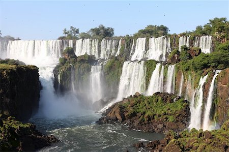 pictures of south america tropical waterfalls - Iguassu waterfalls on a sunny day early in the morning. The biggest waterfalls on earth. Stock Photo - Budget Royalty-Free & Subscription, Code: 400-04681180