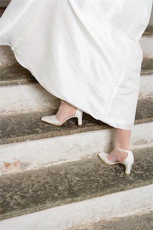 simsearch:695-03378125,k - Bride walking the stairs Stock Photo - Budget Royalty-Free & Subscription, Code: 400-04683579