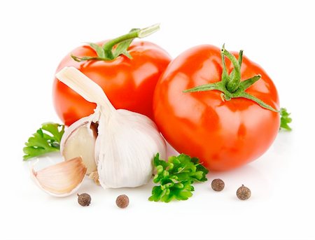 simsearch:400-05664137,k - tomato and garlic vegetables with parsley spice isolated on white background Stock Photo - Budget Royalty-Free & Subscription, Code: 400-04683623