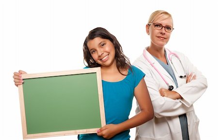 pediatrician latin hispanic - Pretty Hispanic Girl Holding Blank Chalkboard Isolated on a White Background. Stock Photo - Budget Royalty-Free & Subscription, Code: 400-04695258