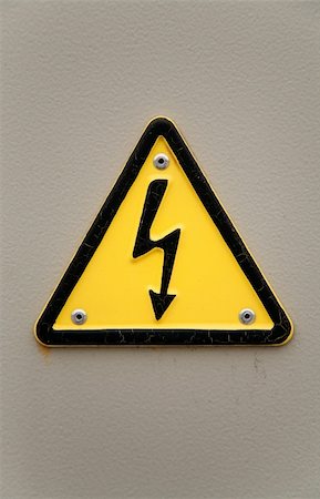 simsearch:400-03993174,k - Grungy high voltage sign over gray wall background Stock Photo - Budget Royalty-Free & Subscription, Code: 400-04695490