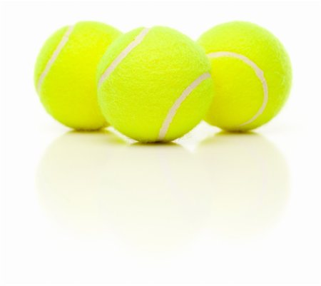 simsearch:400-04833689,k - Three Tennis Balls with Slight Reflection Isolated on a White Background. Stock Photo - Budget Royalty-Free & Subscription, Code: 400-04696279