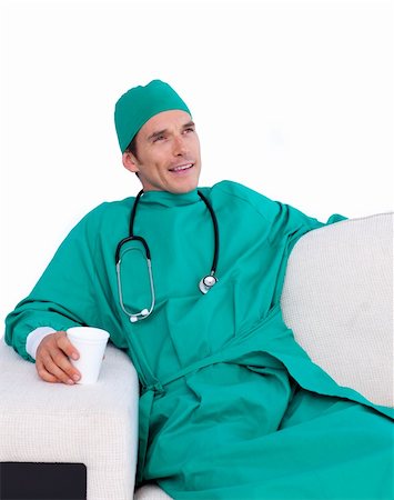 food specialist - Relaxed surgeon drinking coffee in the staff room against a white background Stock Photo - Budget Royalty-Free & Subscription, Code: 400-04696669