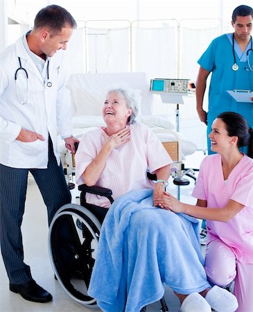 Charming medical team taking care of a senior woman at hospital Stock Photo - Budget Royalty-Free & Subscription, Code: 400-04697194