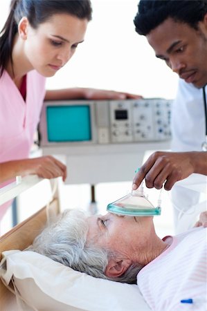 emergency room heart attack - A doctor and a nurse resuscitating a patient in intensive care unit Stock Photo - Budget Royalty-Free & Subscription, Code: 400-04699420