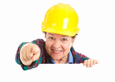 plumber (female) - Female construction worker pointing at you over blank white space.  Isolated design element. Stock Photo - Budget Royalty-Free & Subscription, Code: 400-04699561