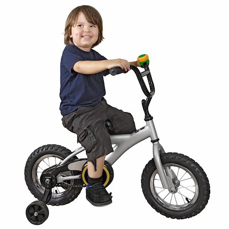 simsearch:400-04638236,k - An adorable 3-year-old riding his bicycle fitted with training wheels. Photographie de stock - Aubaine LD & Abonnement, Code: 400-04699730
