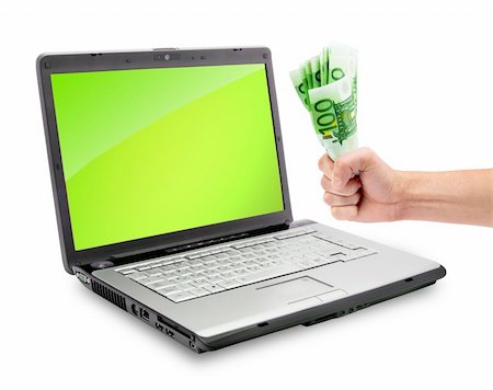 simsearch:700-05452103,k - Open laptop showing keyboard and money in a hand Stock Photo - Budget Royalty-Free & Subscription, Code: 400-04699795