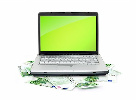simsearch:400-04011910,k - Open laptop with money  isolated on white background Stock Photo - Budget Royalty-Free & Subscription, Code: 400-04699868
