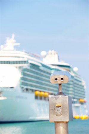 A metallic coin operated viewer for tourists to look at the white holiday cruise liners in the port of Kusadasi, Turkey, on the Aegean Coast Stock Photo - Budget Royalty-Free & Subscription, Code: 400-04690155