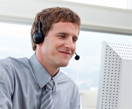 Close-up of businessman working in a call center in a company Stock Photo - Budget Royalty-Free & Subscription, Code: 400-04690629