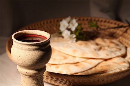 Chalice with red wine and pita bread in a basket Stock Photo - Budget Royalty-Free & Subscription, Code: 400-04691032