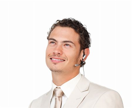 simsearch:400-05145011,k - Young businessman with headset on looking up against a white background Stock Photo - Budget Royalty-Free & Subscription, Code: 400-04691278
